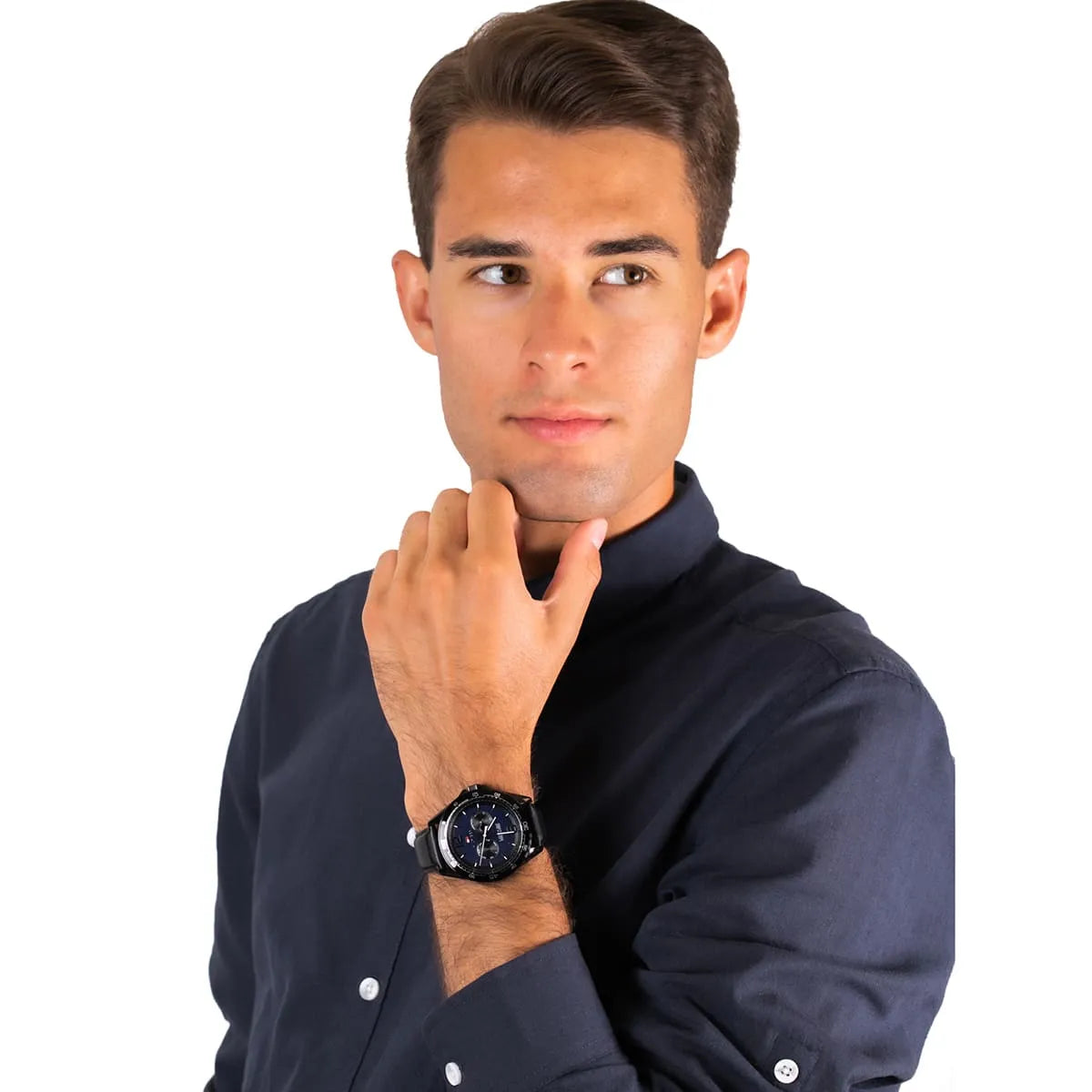 Model wearing Tommy Hilfiger men's watch with blue dial and chronograph subdials