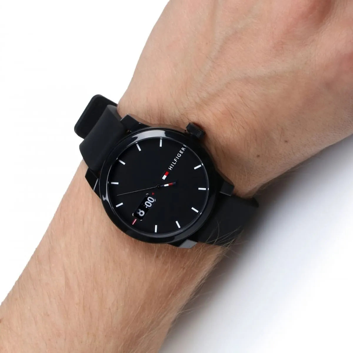 Tommy Hilfiger men's watch worn on wrist showing black dial and case