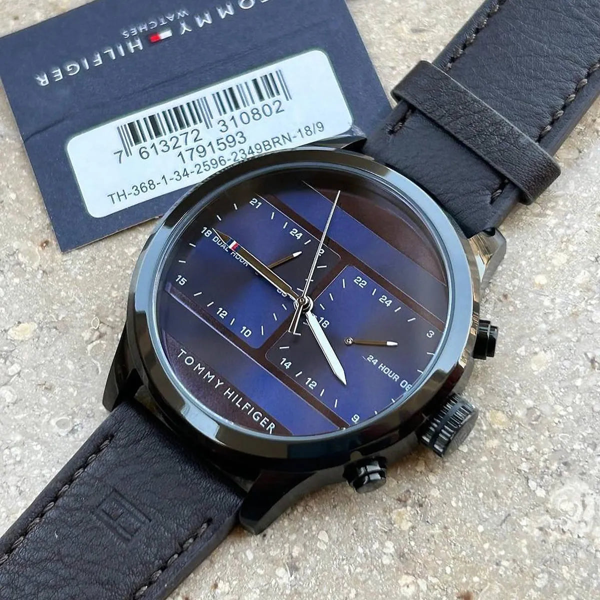Tommy Hilfiger watch with box packaging and blue dial visible
