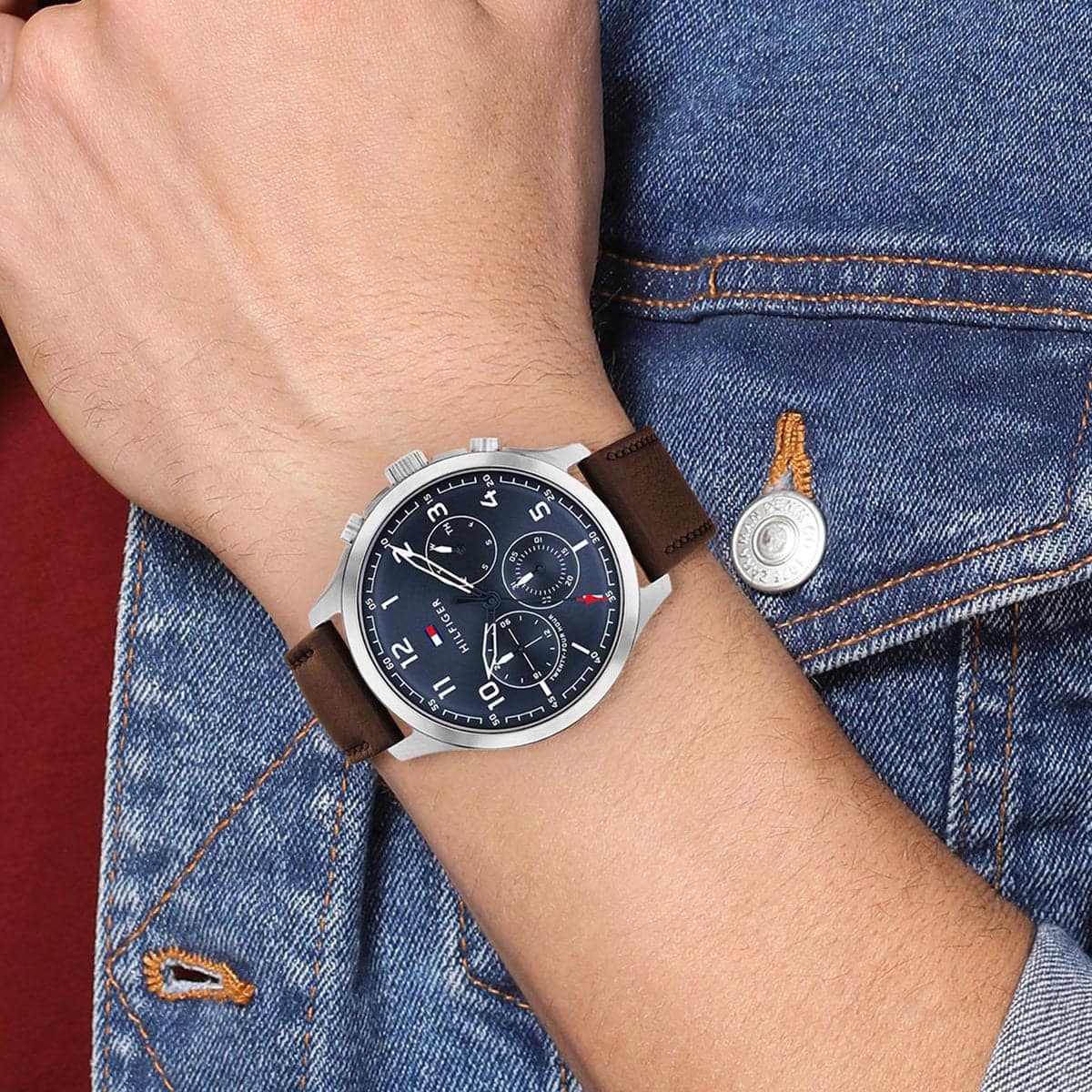 Tommy Hilfiger ASHER watch worn on wrist with blue dial and brown leather strap