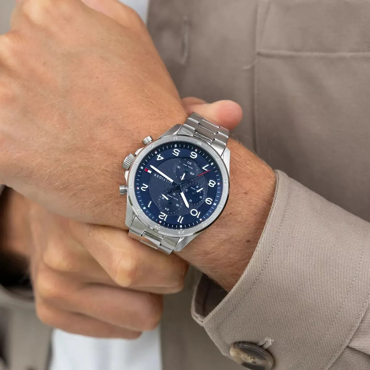 Tommy Hilfiger Axel watch on wrist showing chronograph subdials and blue dial detail