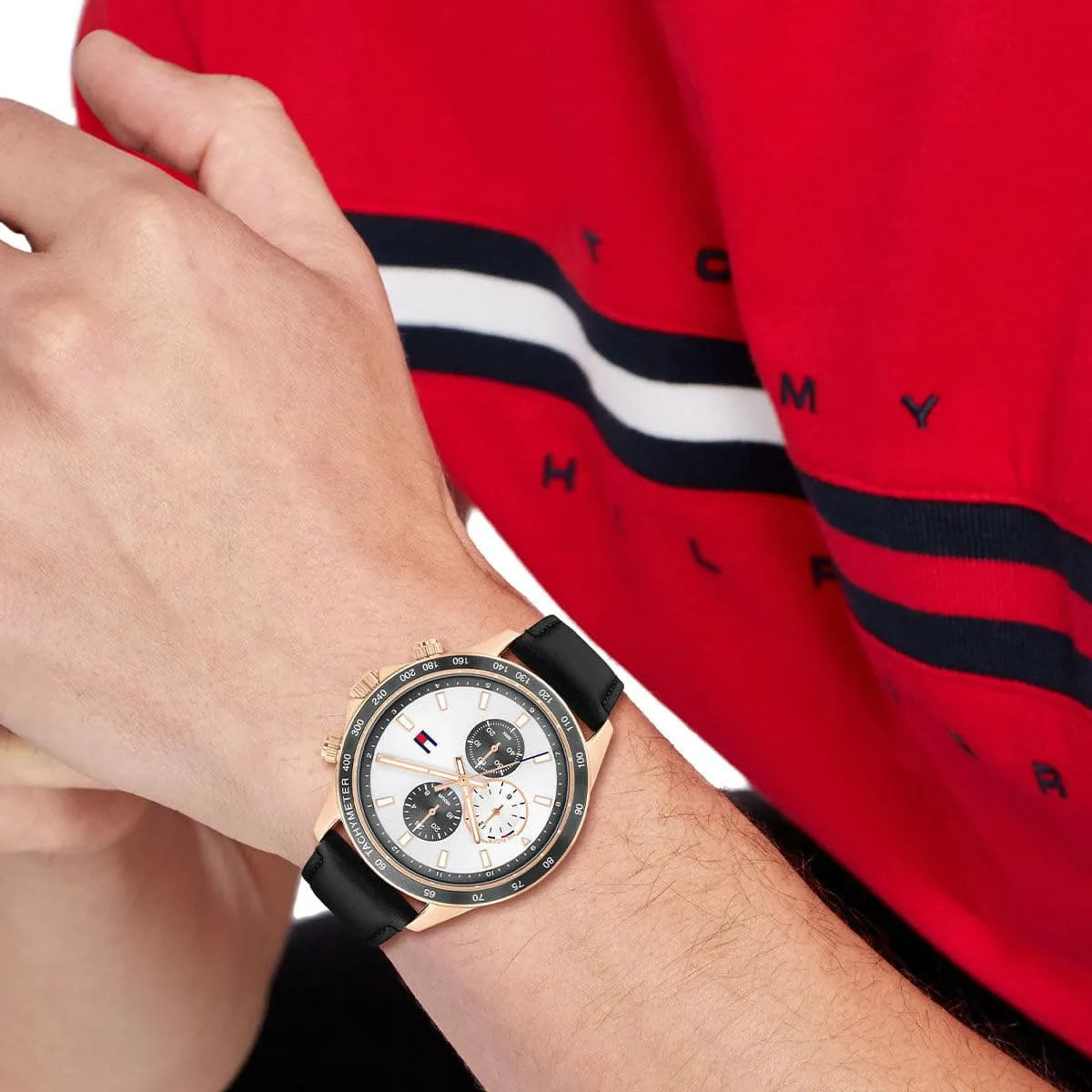 Tommy Hilfiger watch worn with red Tommy Hilfiger jacket showing chronograph design