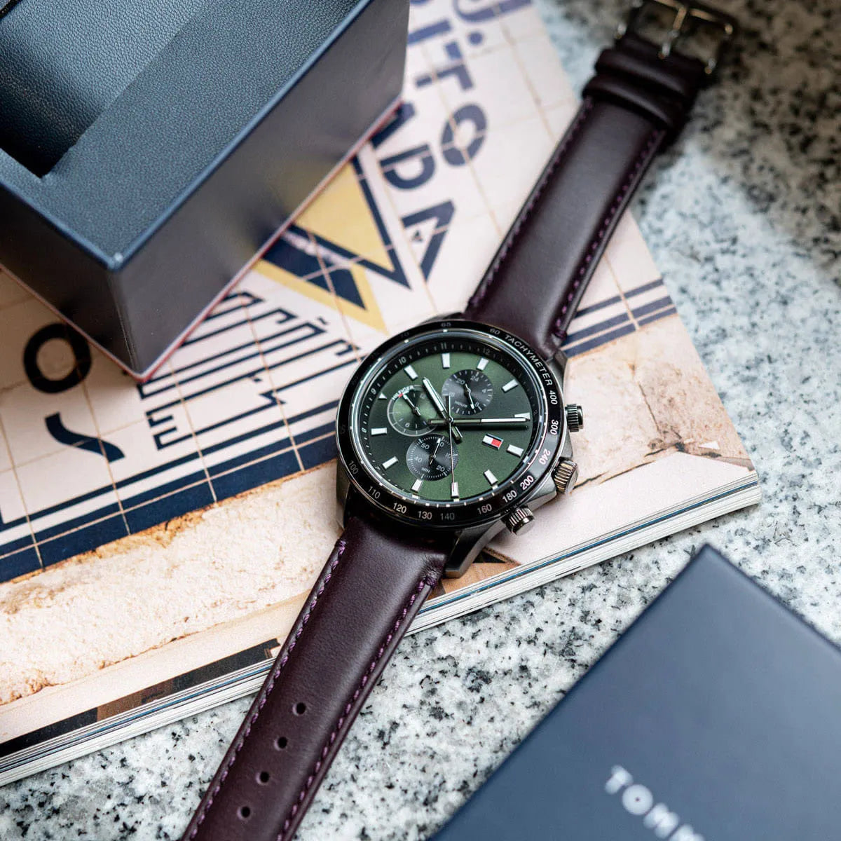 Tommy Hilfiger Miles watch on magazine with green dial and brown leather strap