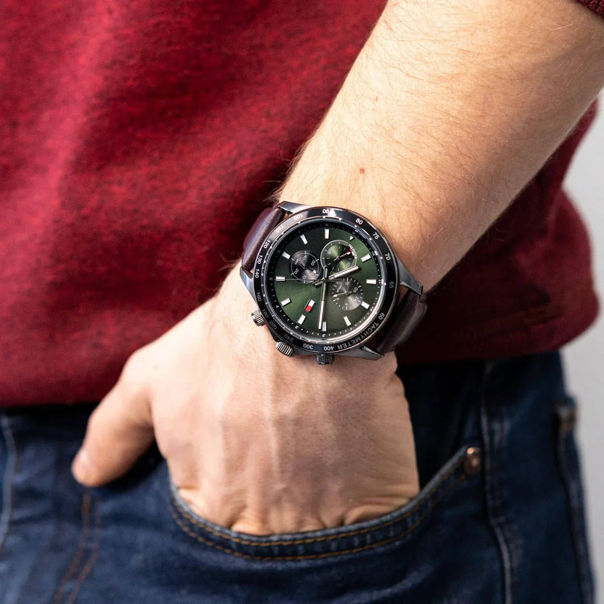 Tommy Hilfiger Miles watch on wrist with red and burgundy clothing