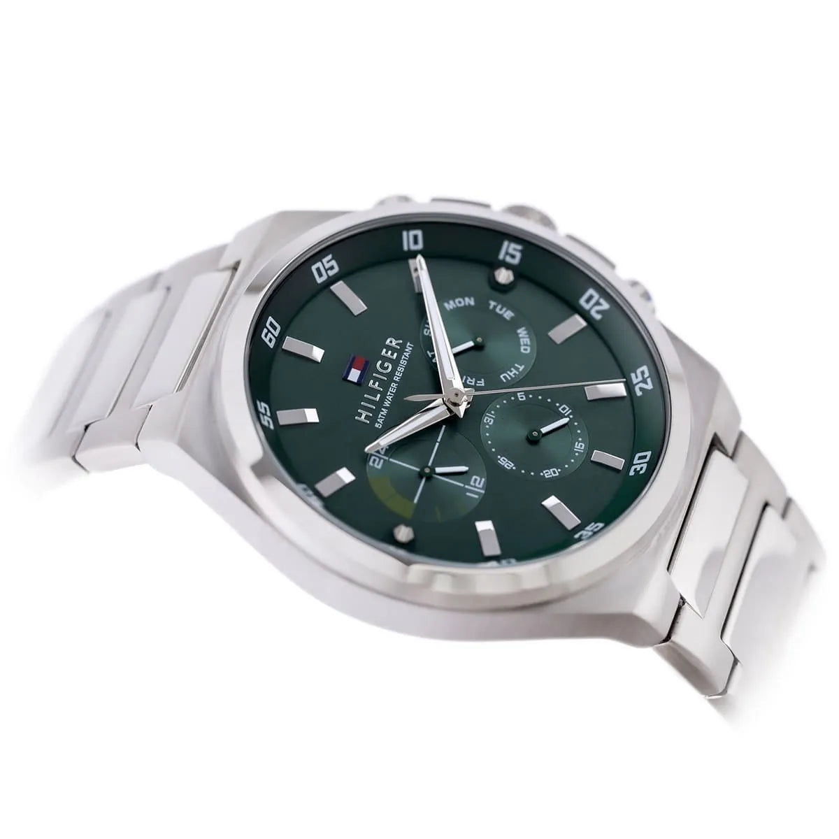 Side profile of Tommy Hilfiger Dexter watch showing green dial and metal bracelet