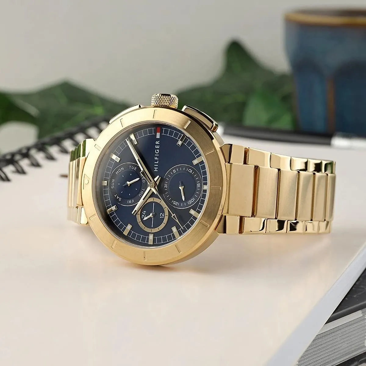 Tommy Hilfiger Lorenzo chronograph watch styled on white surface with decorative objects