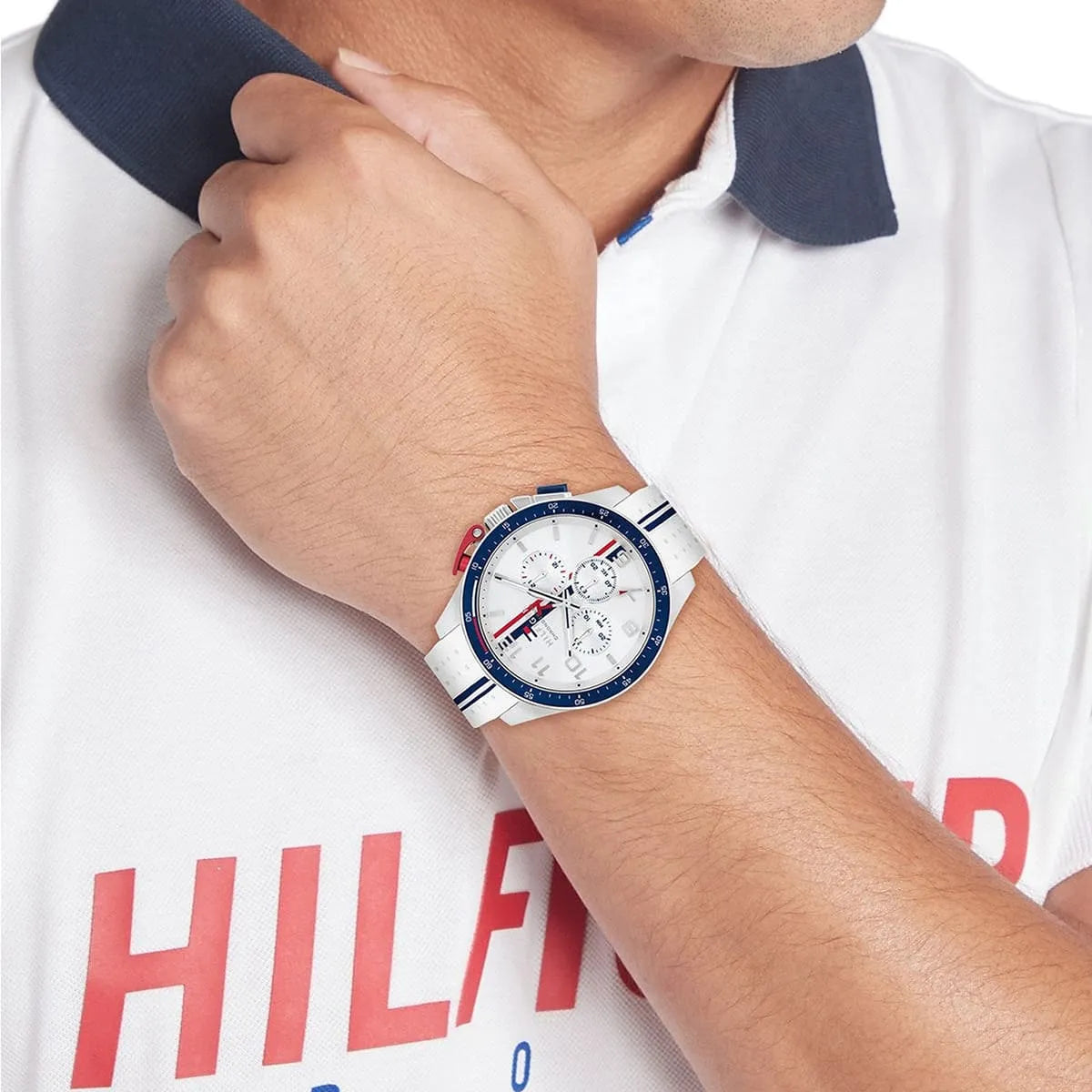 Tommy Hilfiger chronograph watch on wrist showing white silicone strap and white dial chronograph