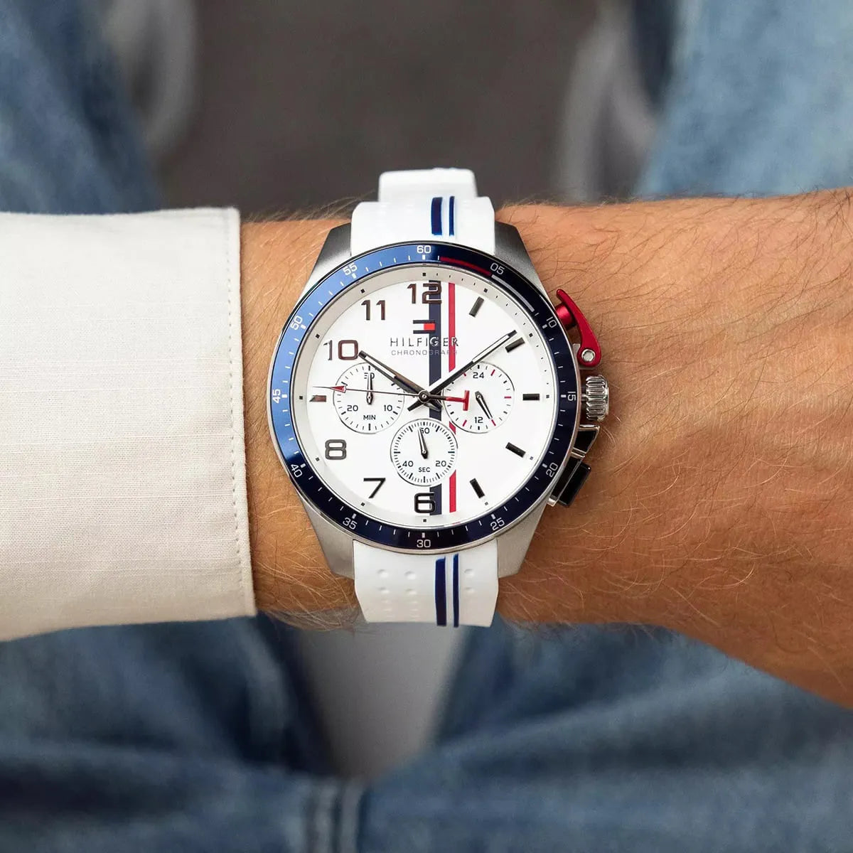 Tommy Hilfiger white silicone chronograph watch worn on wrist with white dial visible