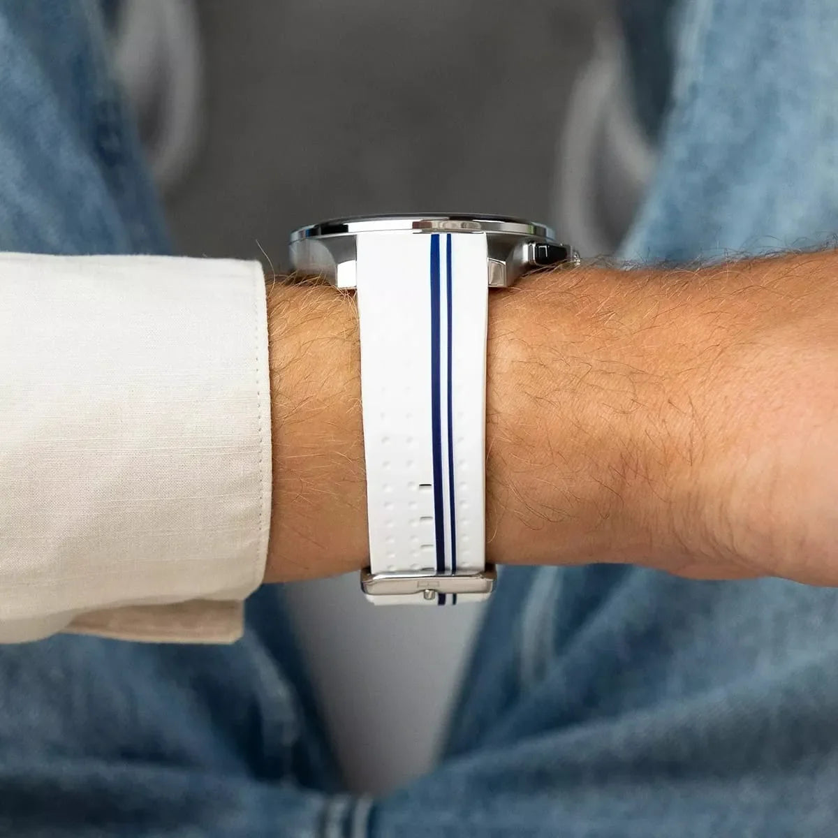 Tommy Hilfiger watch white silicone strap with navy stripes worn on wrist
