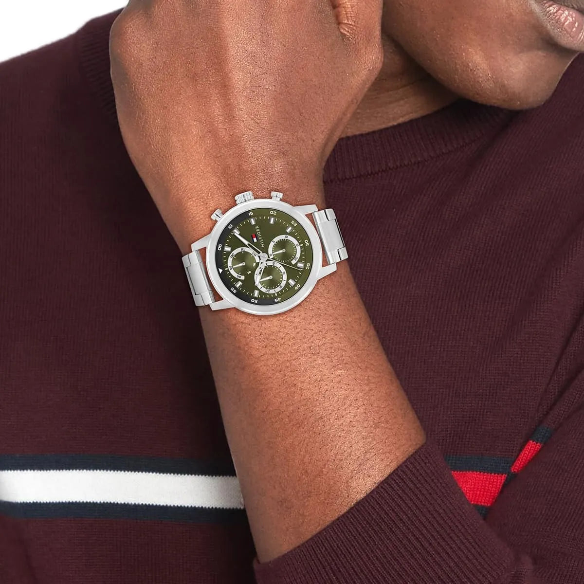 Tommy Hilfiger green dial chronograph watch worn on wrist