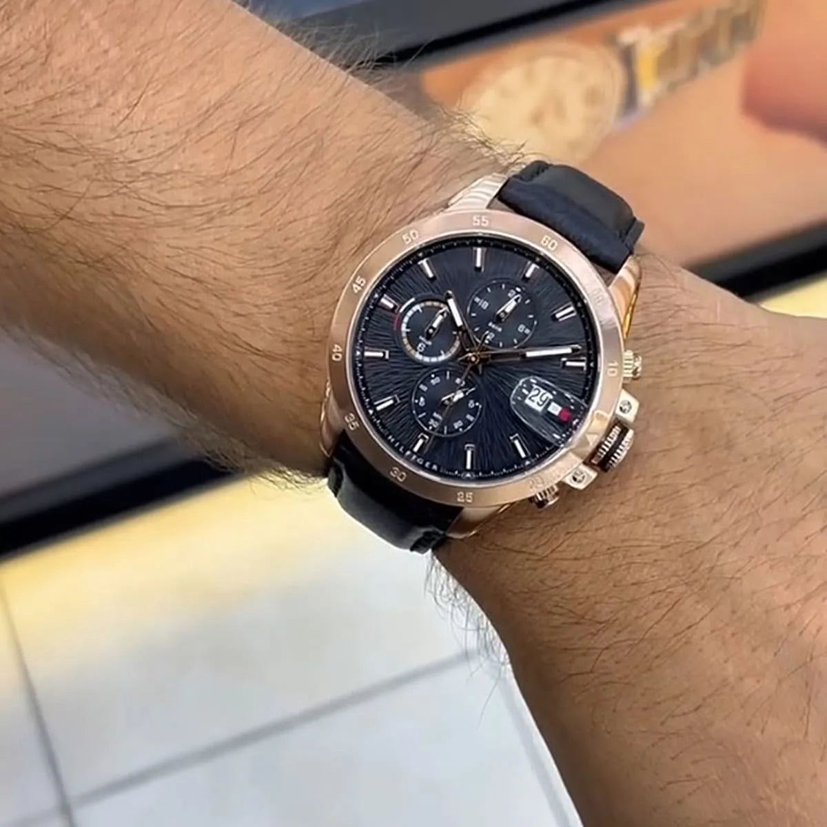 Tommy Hilfiger Jameson chronograph watch worn on wrist with black leather strap