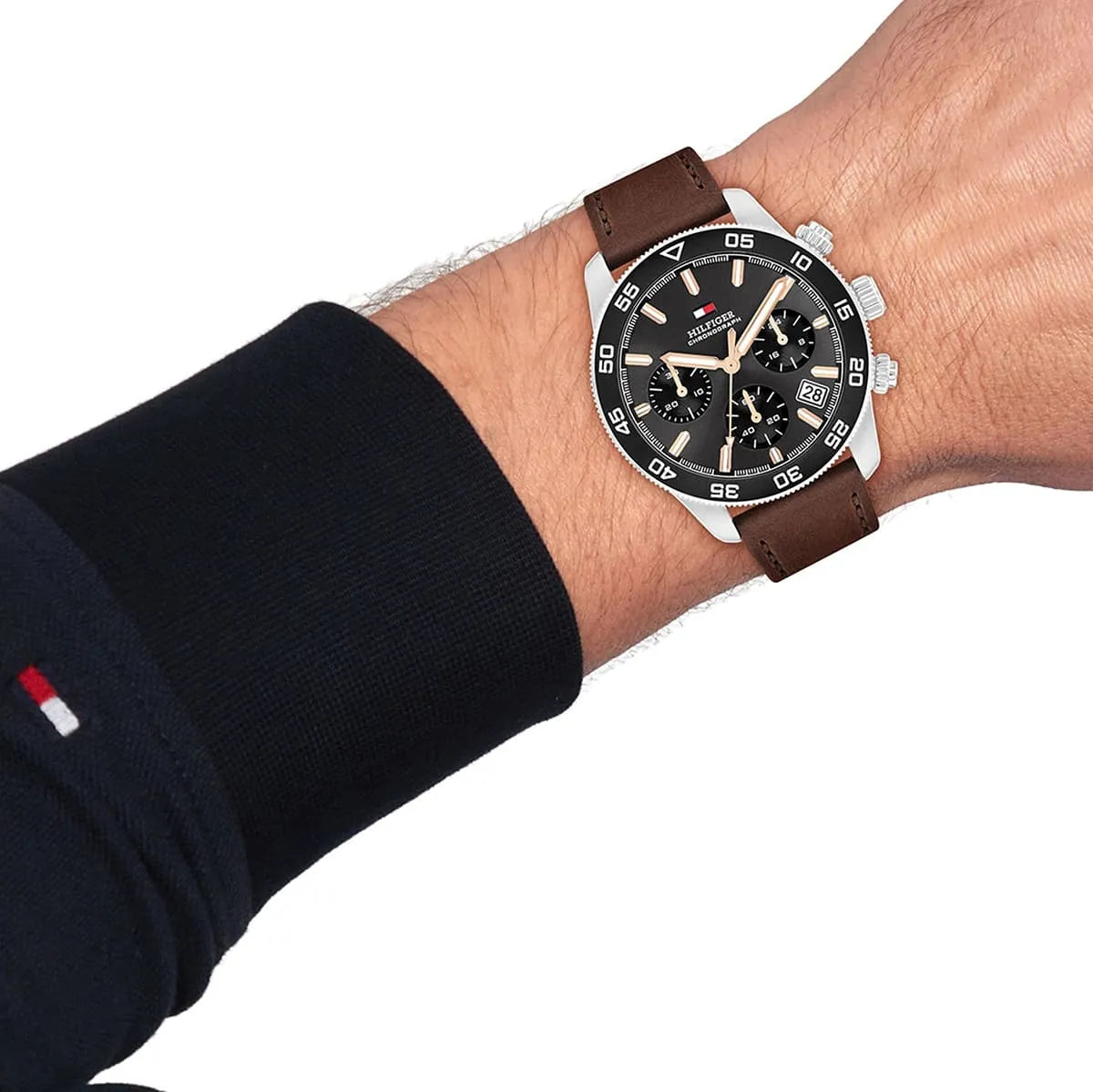 Tommy Hilfiger chronograph watch worn on wrist showing dark grey dial and chronograph subdials