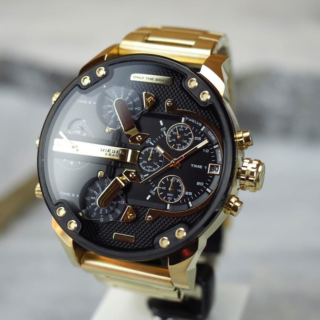 Diesel Big Daddy gold watch with black dial on wrist showing chronograph subdials and gold accents