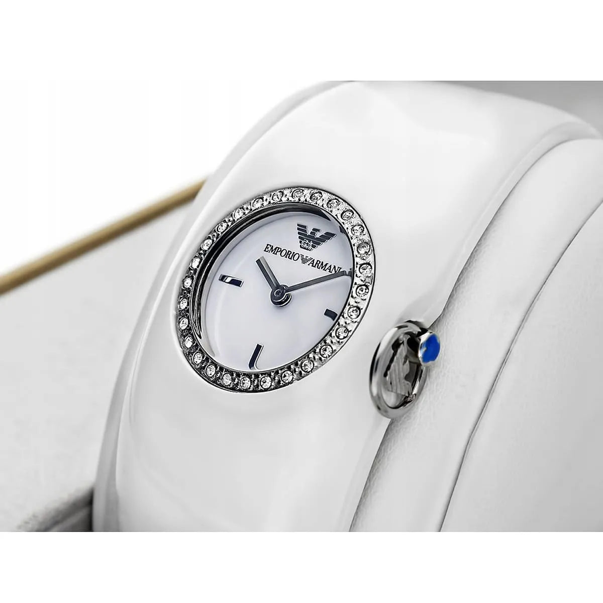 Angled view of Emporio Armani AR0740 showing white ceramic strap and dial detail