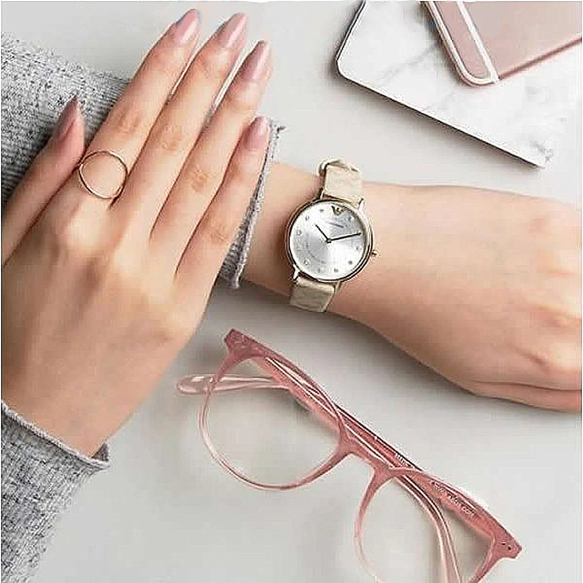 Emporio Armani AR11042 watch worn on wrist with beige leather strap