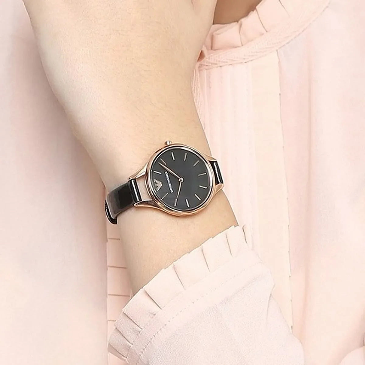 Emporio Armani Aurora watch worn on wrist with black dial and black leather strap