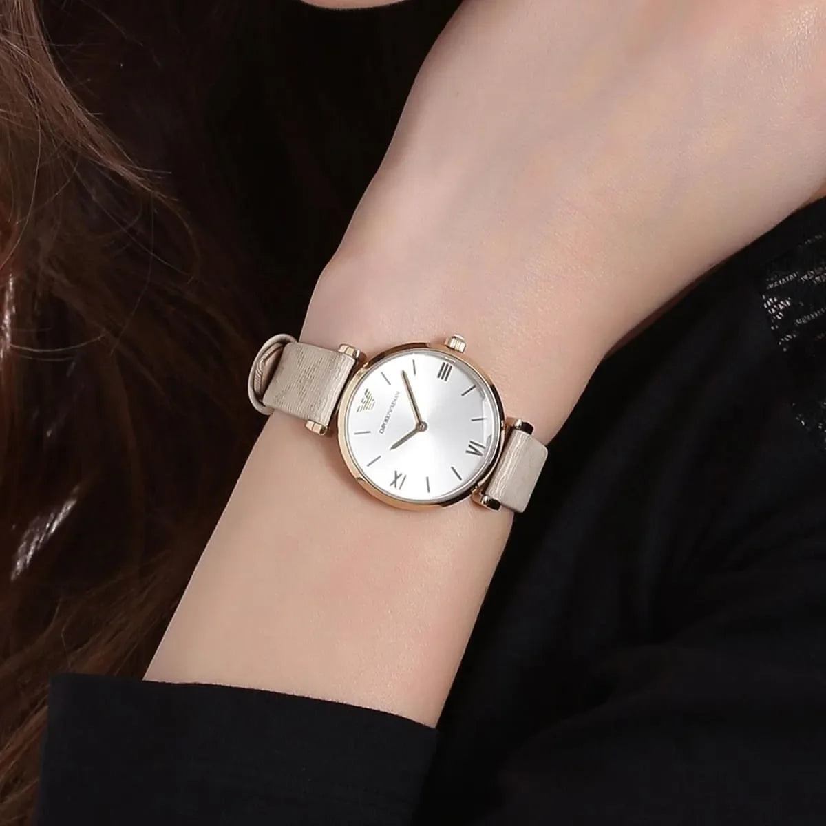 Emporio Armani AR11127 worn on wrist showing silver dial and gold-tone case