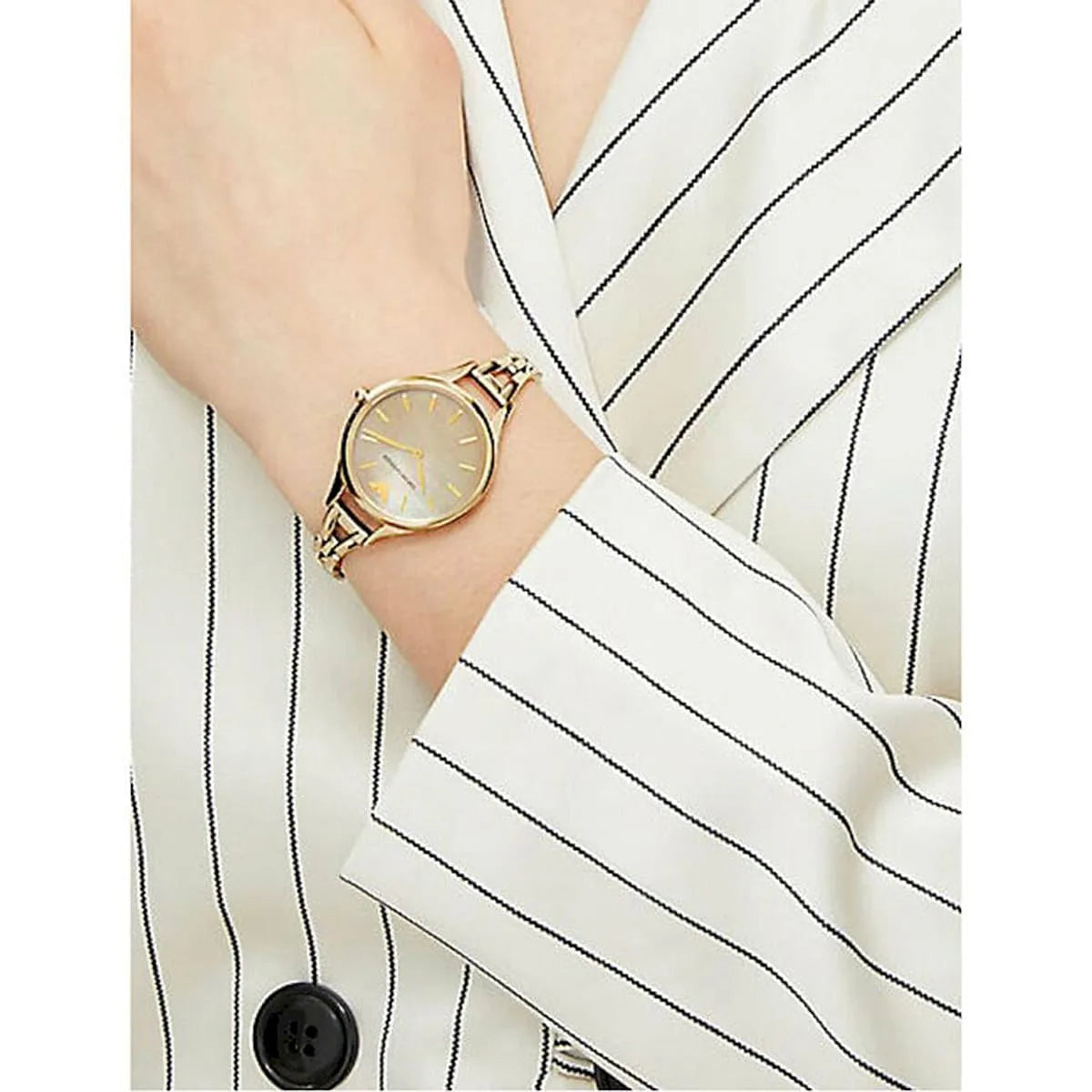 Emporio Armani AURORA AR11140 on wrist with mother-of-pearl dial and gold-tone bracelet