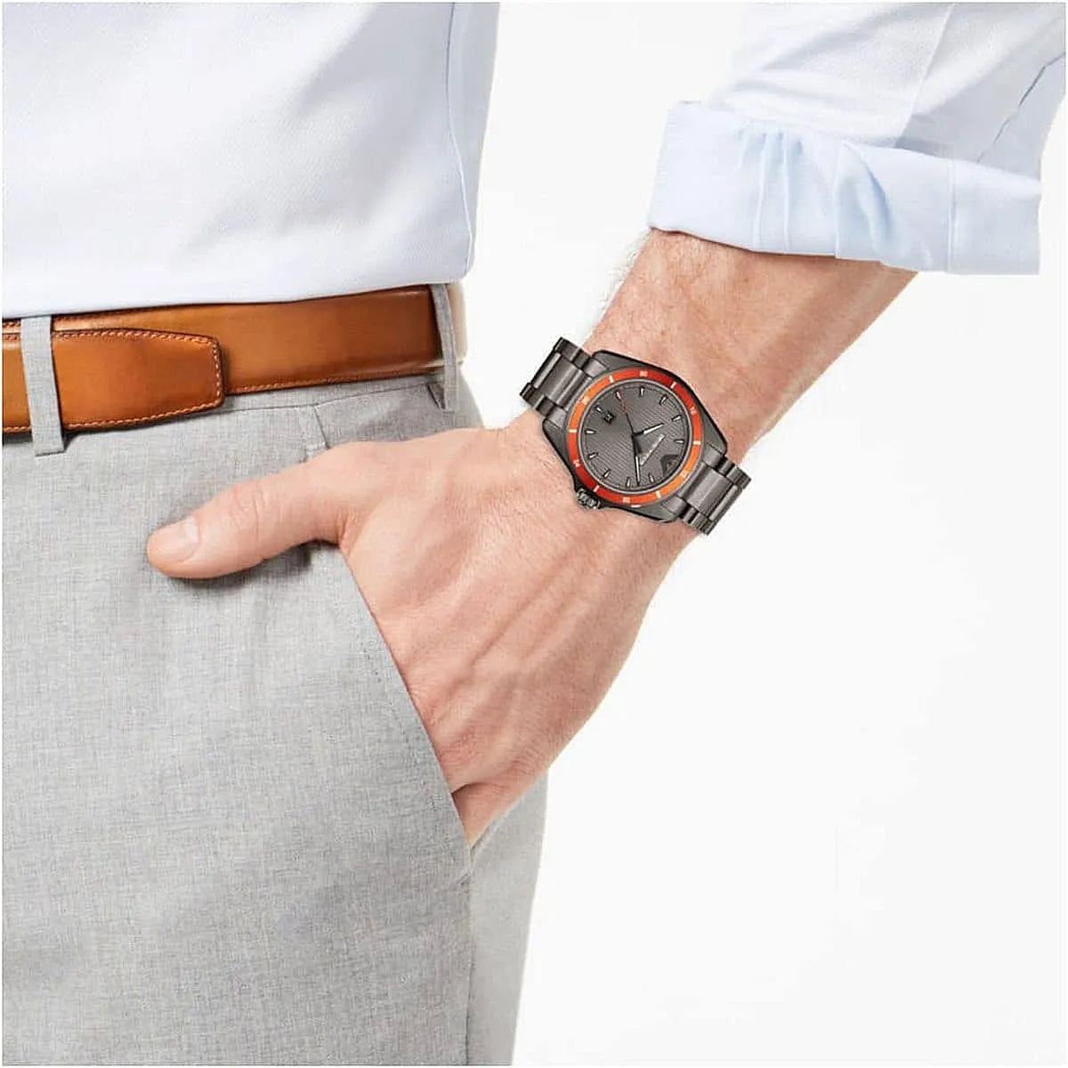 Emporio Armani Sigma watch on wrist with grey trousers and white shirt, side view