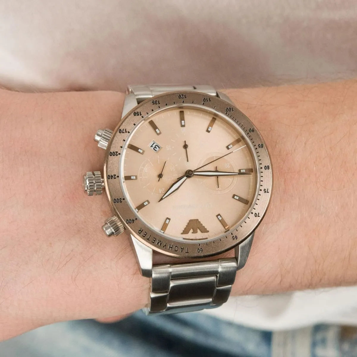 On-wrist view of Mario chronograph with brown dial and tachymeter bezel