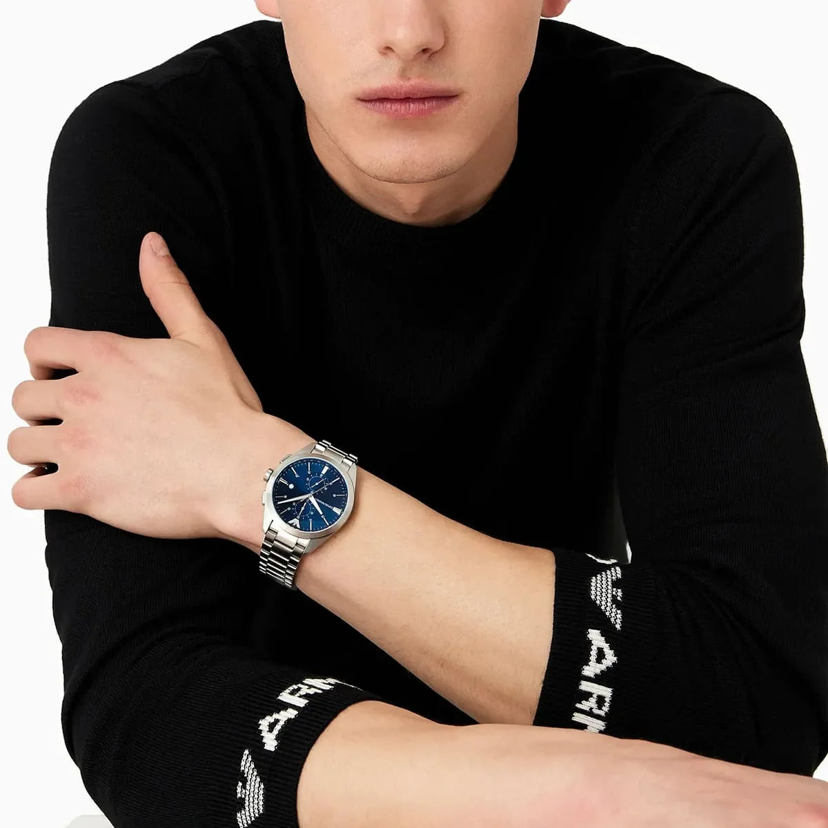 Emporio Armani Claudio watch worn on wrist with blue dial and silver bracelet
