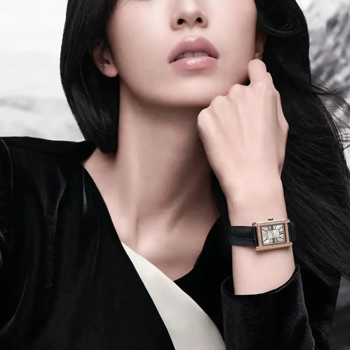 Emporio Armani Genni AR11624 women's watch worn on wrist with rose gold case and black leather strap