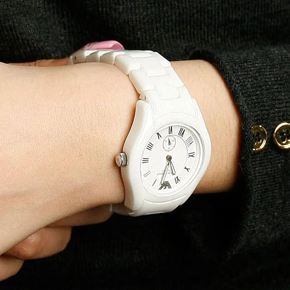 Emporio Armani AR1405 ceramic women's watch on wrist with white bracelet