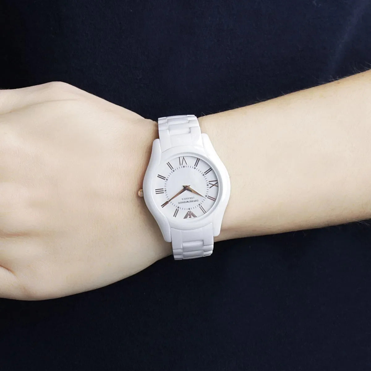 Emporio Armani AR1473 Ceramica white watch on woman's wrist with roman numeral dial