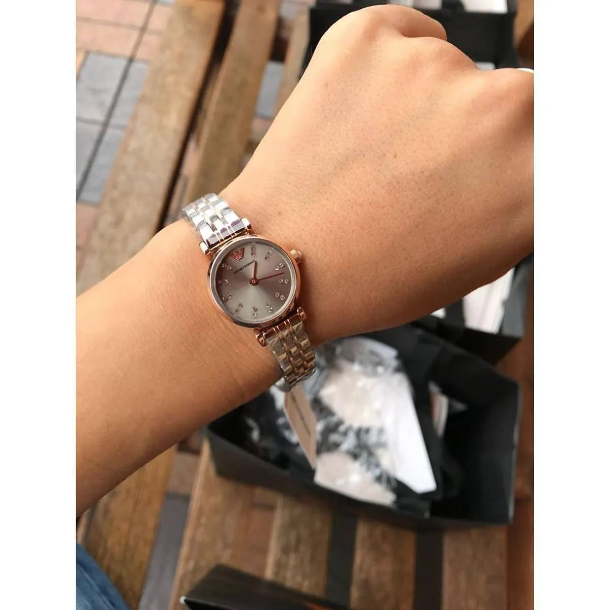 AR1841 Emporio Armani watch on wrist displaying rose gold case with three-hand analog movement