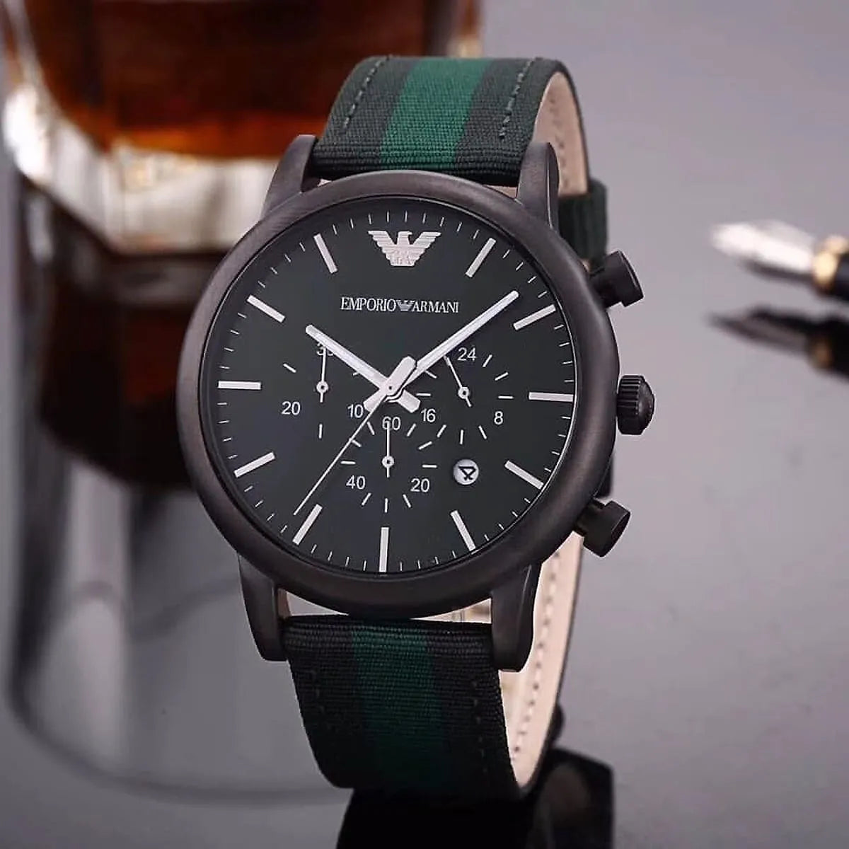 Emporio Armani AR1950 watch styled with beverage on fabric background