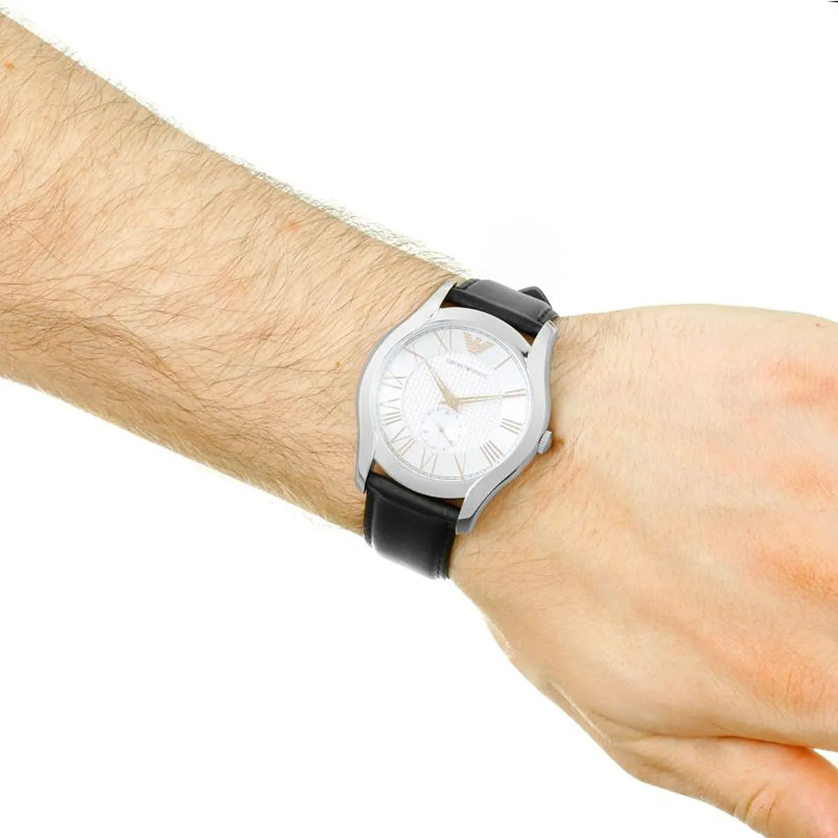 Emporio Armani AR1984 dress watch on wrist with silver dial and black leather strap