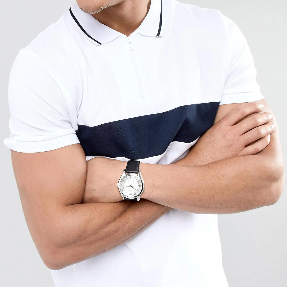 Emporio Armani AR1984 dress watch on wrist with white and navy polo shirt
