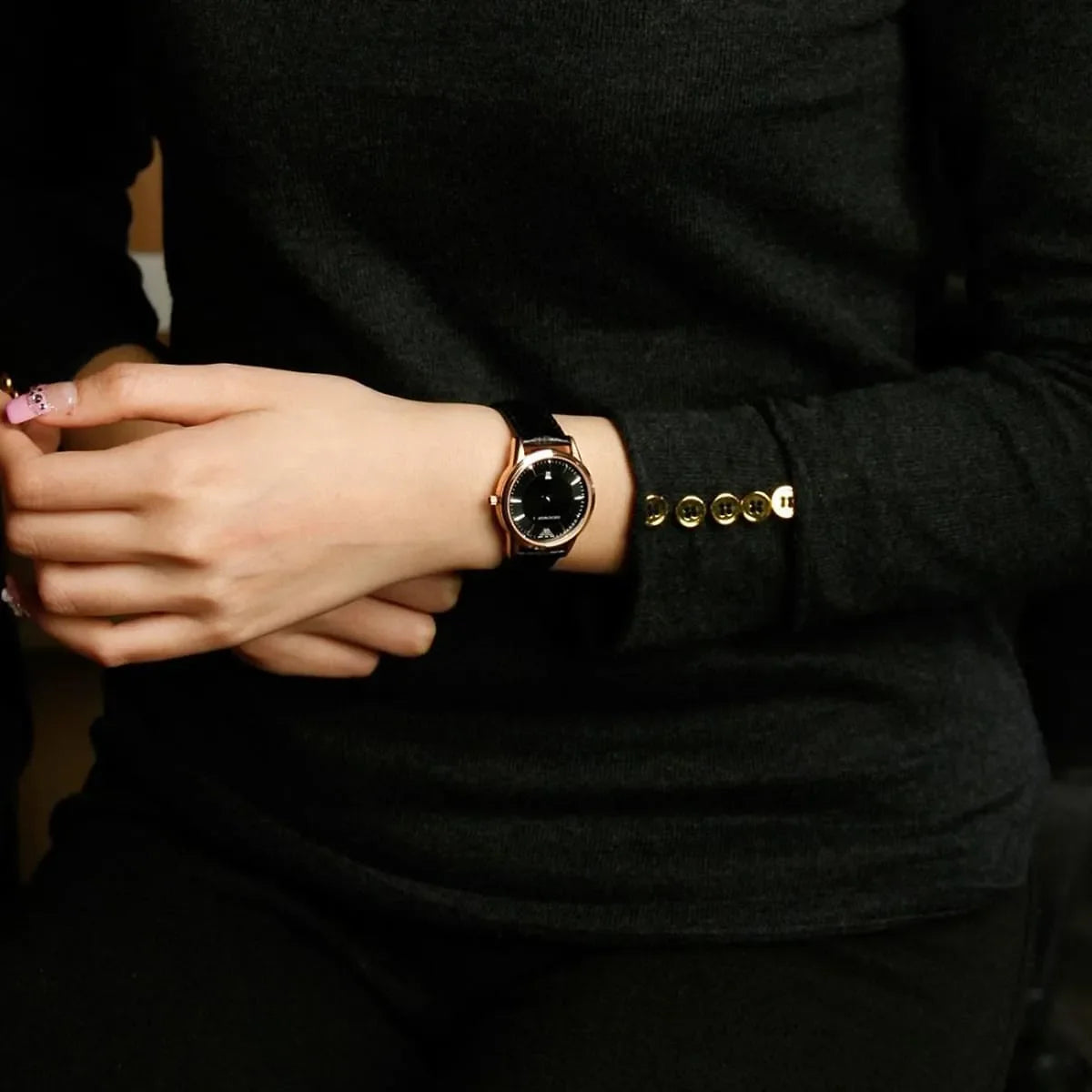 Emporio Armani AR2445 watch on wrist showing black leather strap and rose gold case details