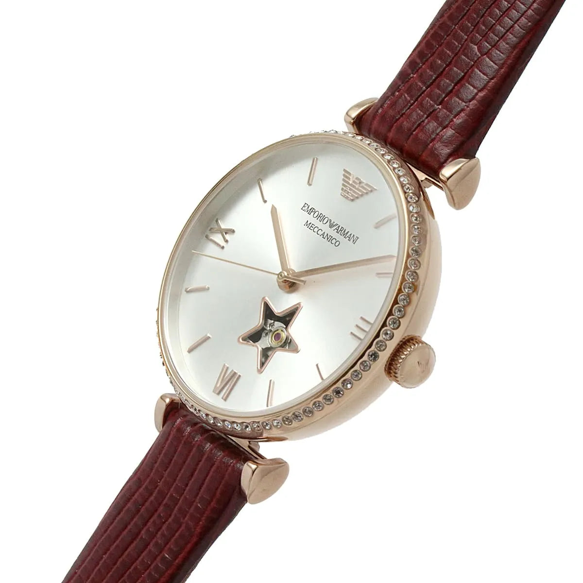 Emporio Armani Meccanico rose gold women's watch on wrist with burgundy leather strap