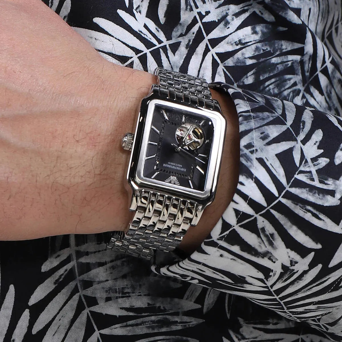 Emporio Armani Diego AR60057 automatic watch worn on wrist showing black dial and silver bracelet