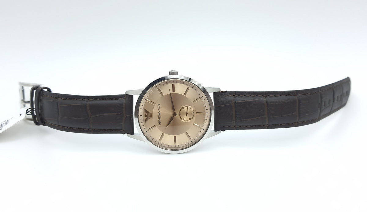 Emporio Armani Kappa AR9106 worn on wrist displaying brown dial and leather strap