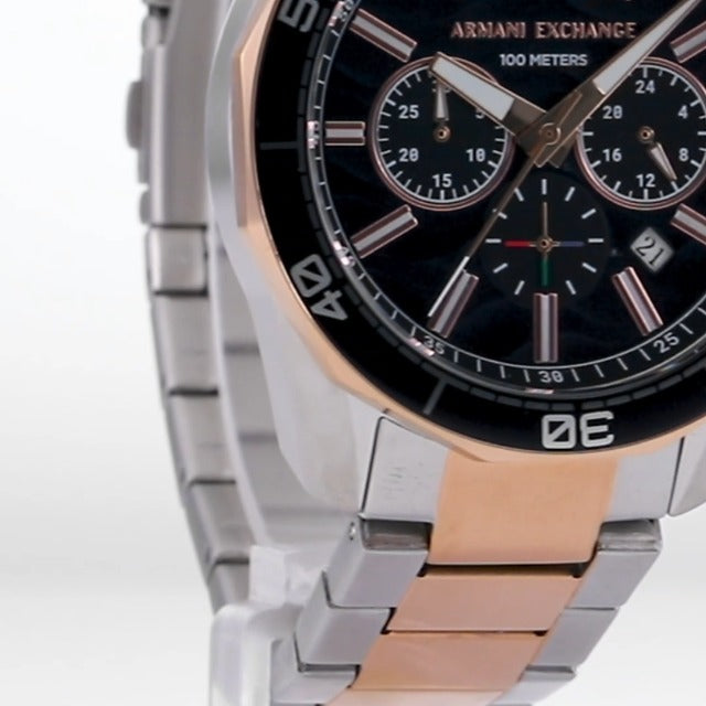 Close-up of AX1965 dial showing chronograph subdials and two-tone case detail