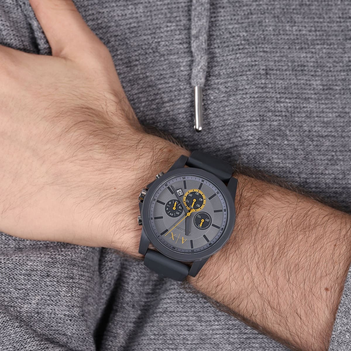 Armani Exchange AX7123 chronograph watch on wrist with grey dial and yellow chronograph subdials