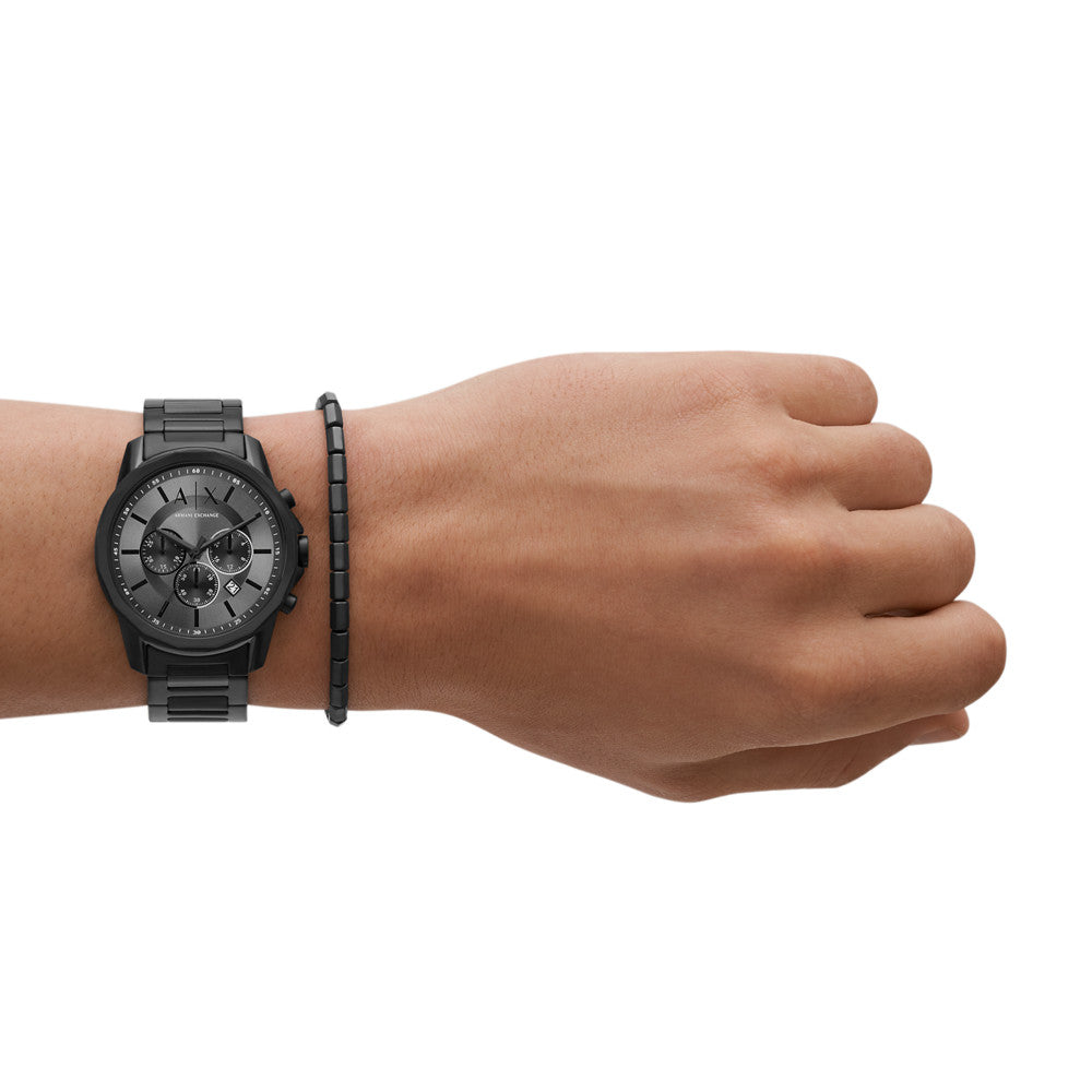 AX7140 chronograph watch worn on wrist with black stainless steel band