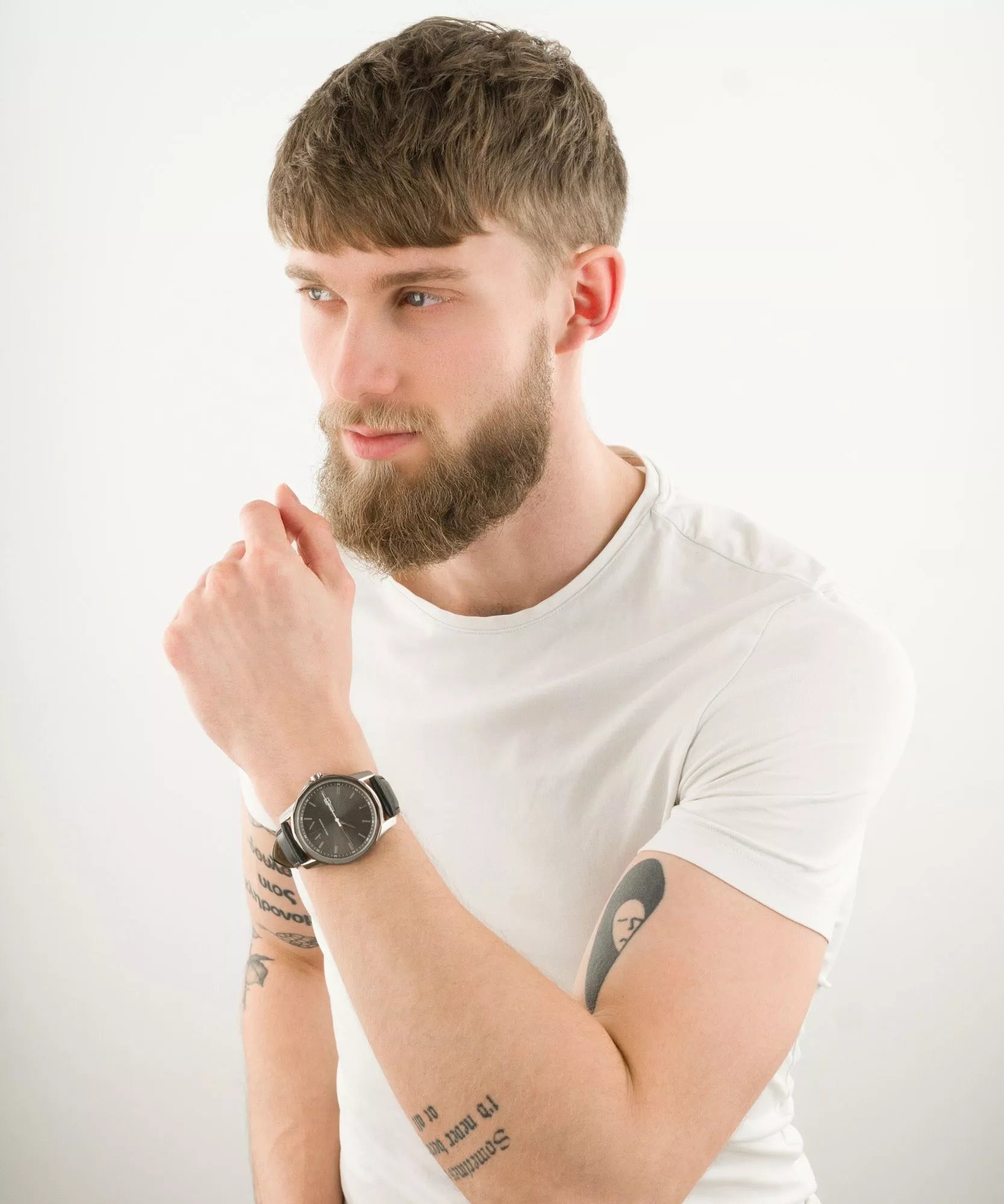 Armani Exchange Banks AX1735 watch worn on man's wrist with white t-shirt