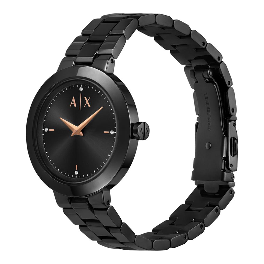 Armani Exchange Jackie all-black women's watch worn on wrist showing golden hands and dial