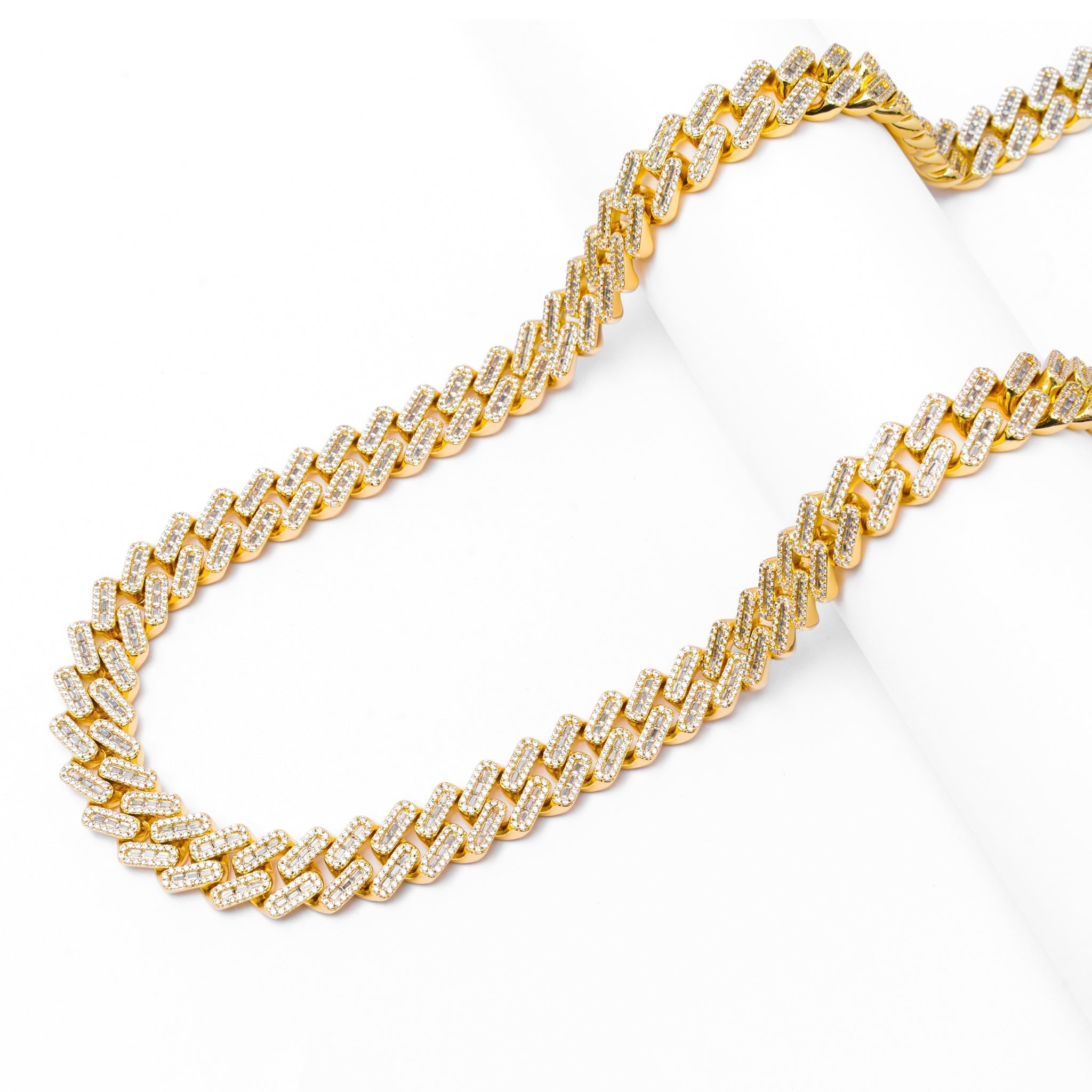 Full length view of 12MM Cuban chain with diamond-cut links and iced out baguette design