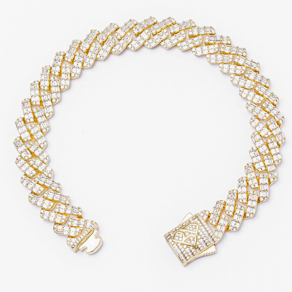 Big Daddy 12MM gold Cuban bracelet angle view showing diamond baguette inlay and clasp