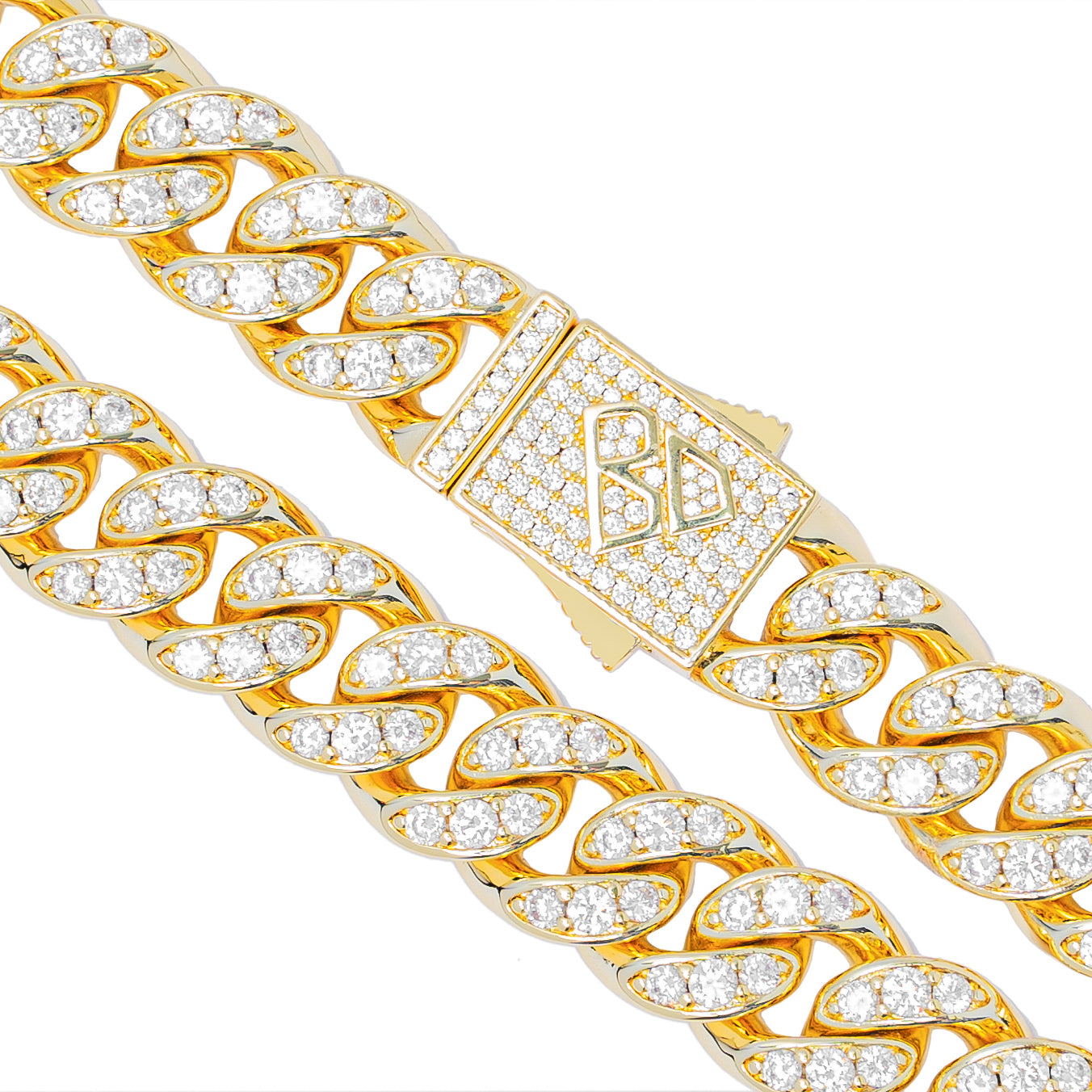 Close-up of gold Cuban link chain with crystals and branded clasp