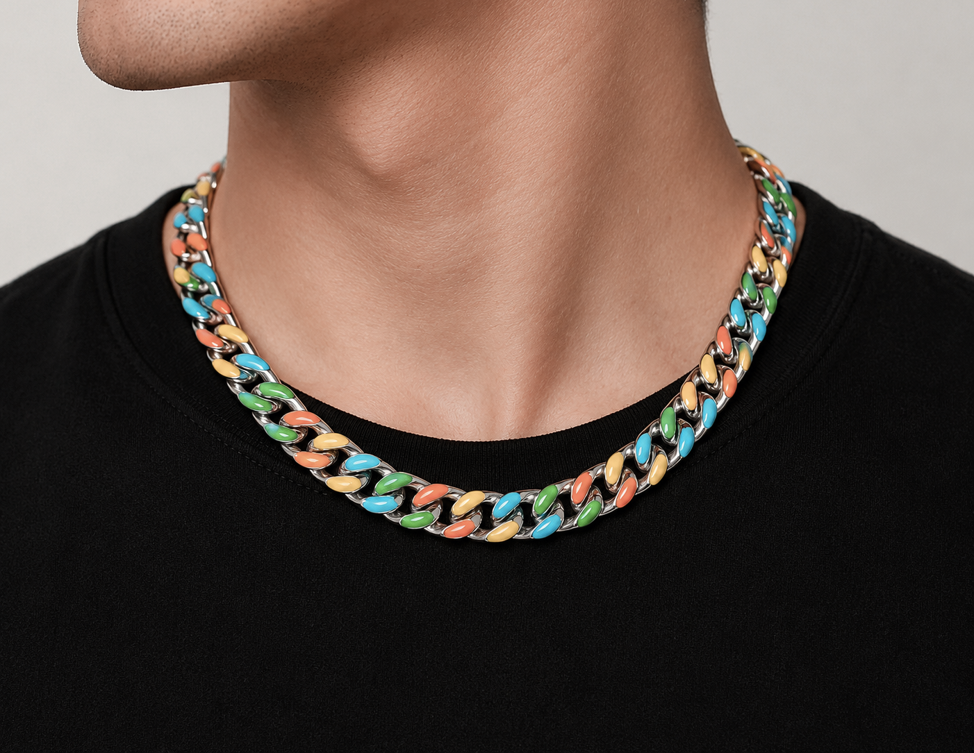 Multi-colour enamel Cuban chain necklace worn on person, rainbow link design