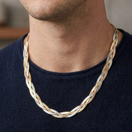 Two-tone gold and silver herringbone chain worn on neck