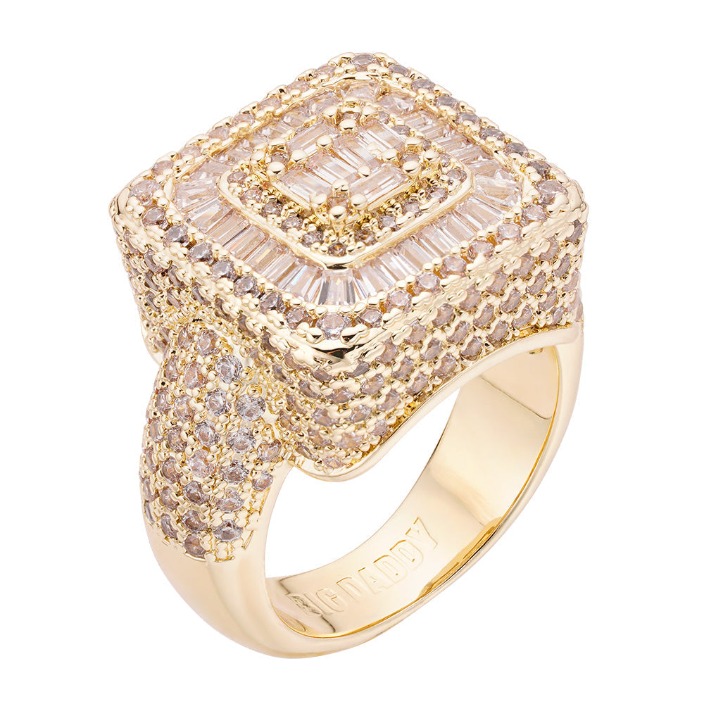 Gold iced out ring with square face featuring baguette and round diamonds