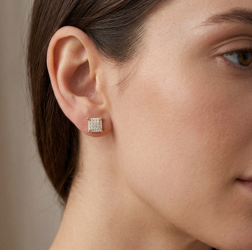Big Daddy emerald cut diamond stud earring worn on ear, profile view