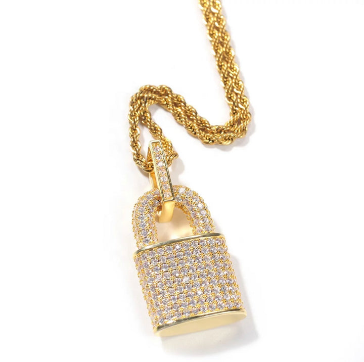 Iced out gold padlock pendant shown at angle with textured cubic zirconia