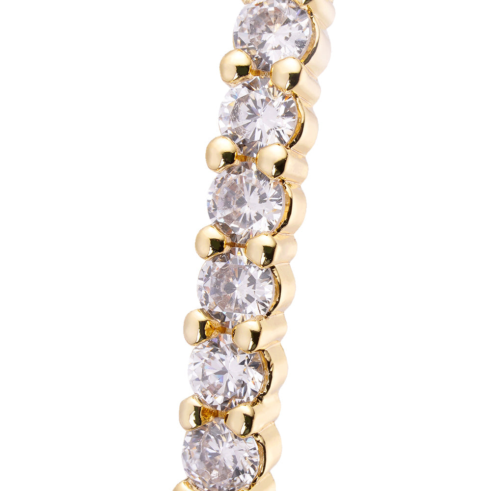 Close-up detail of iced out cubic zirconia stones on hoop earring